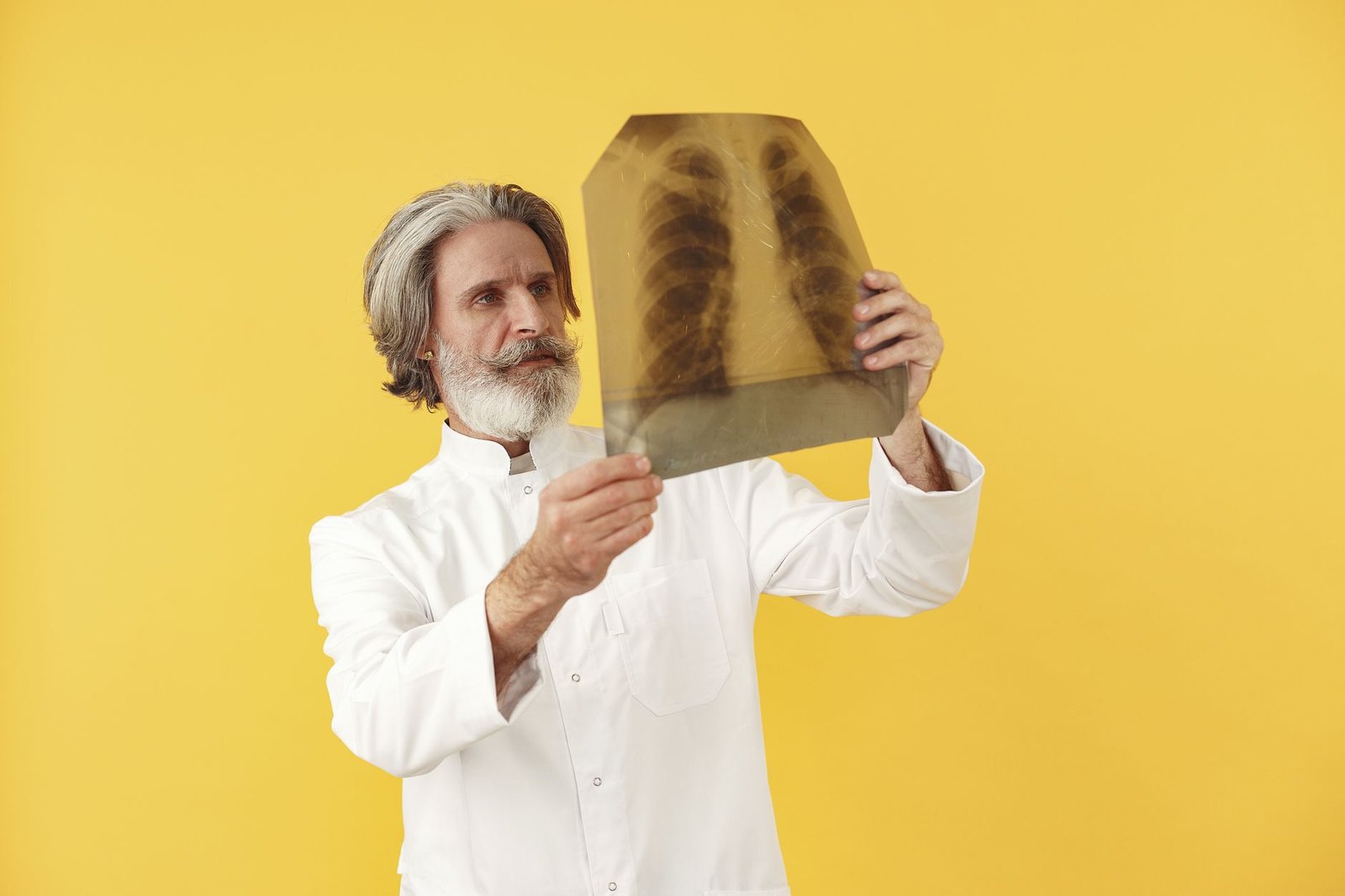 Veteran taking a pulmonary function test used in a VA respiratory DBQ