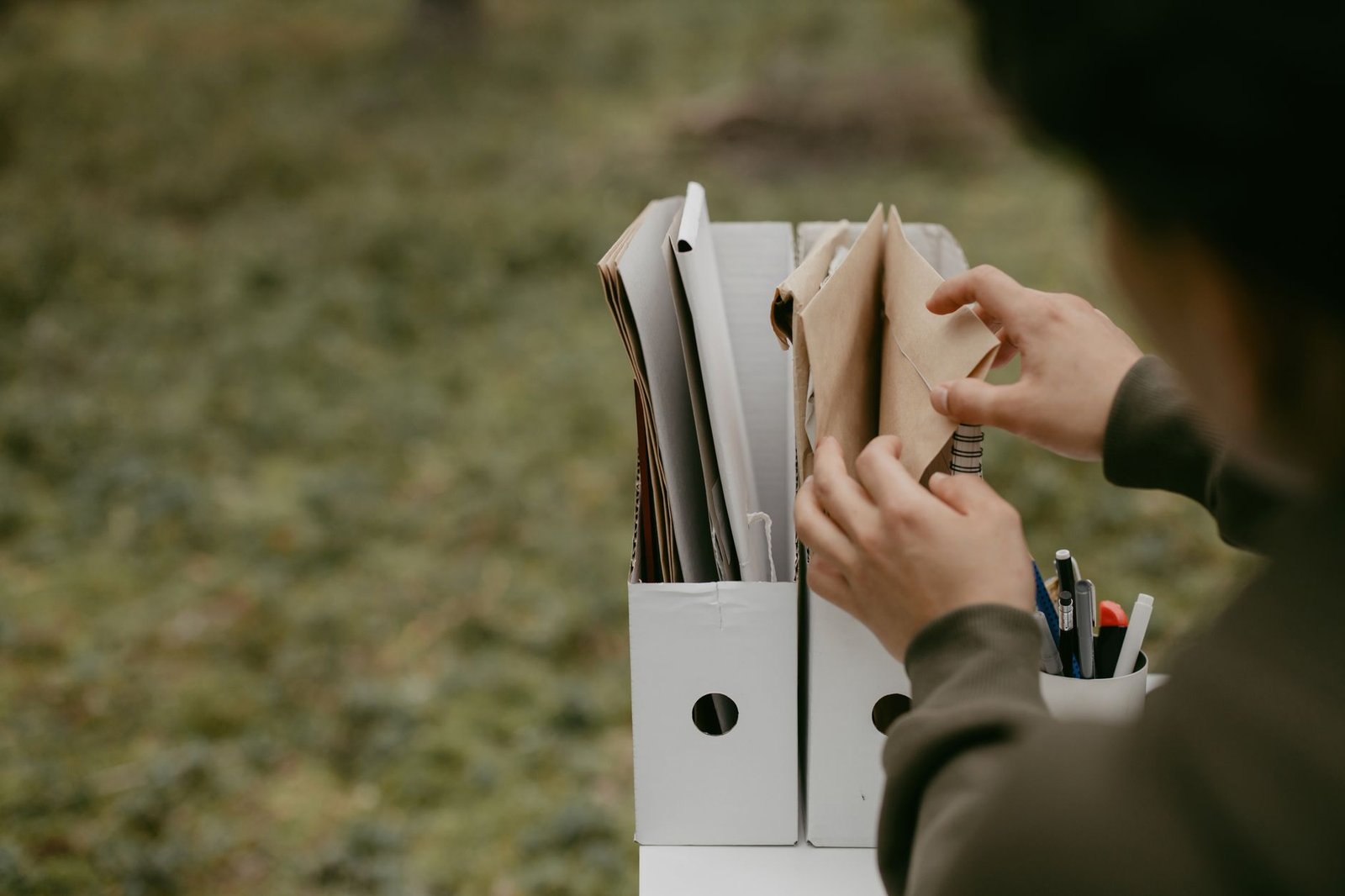 Hands organizing medical evidence for rare mesothelioma types VA claims paperwork