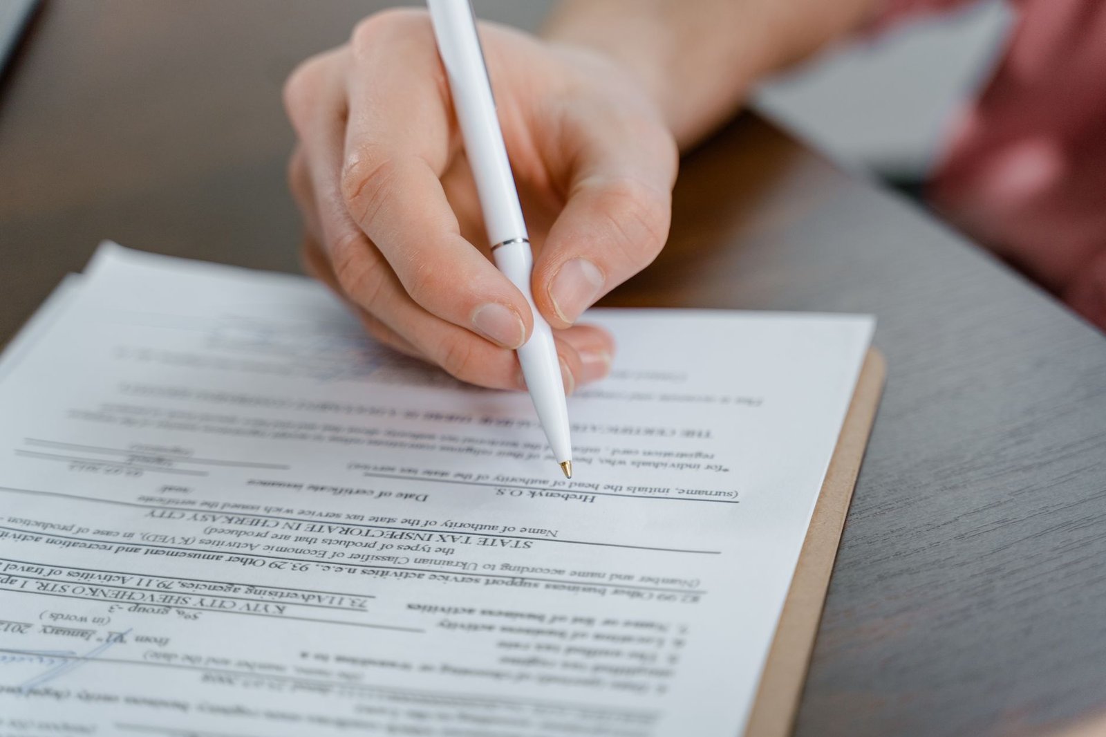 Older veteran completing VA paperwork about engine-room asbestos exposure at home