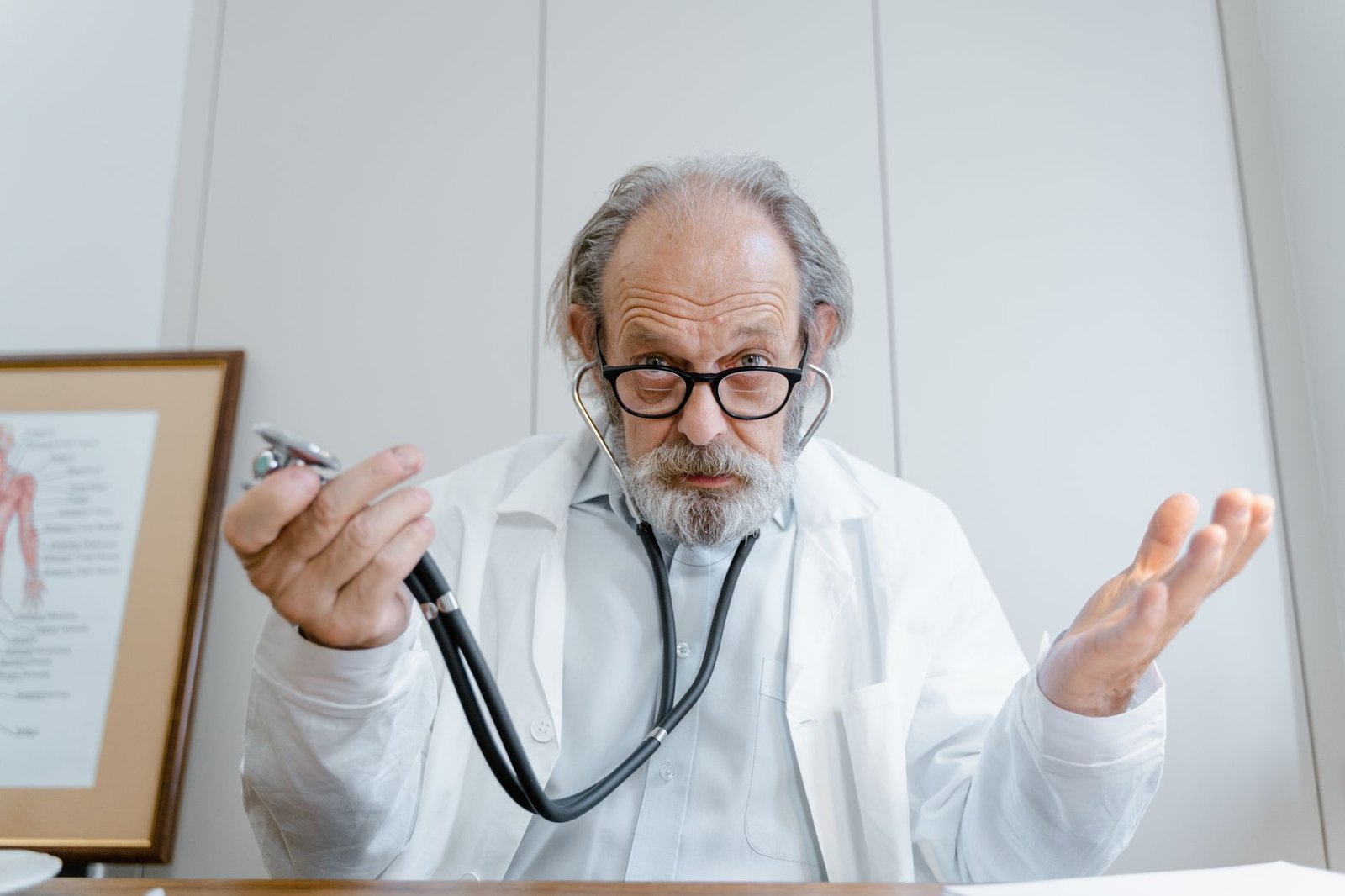 Veteran discussing rare mesothelioma types VA claims with a physician in a bright clinic