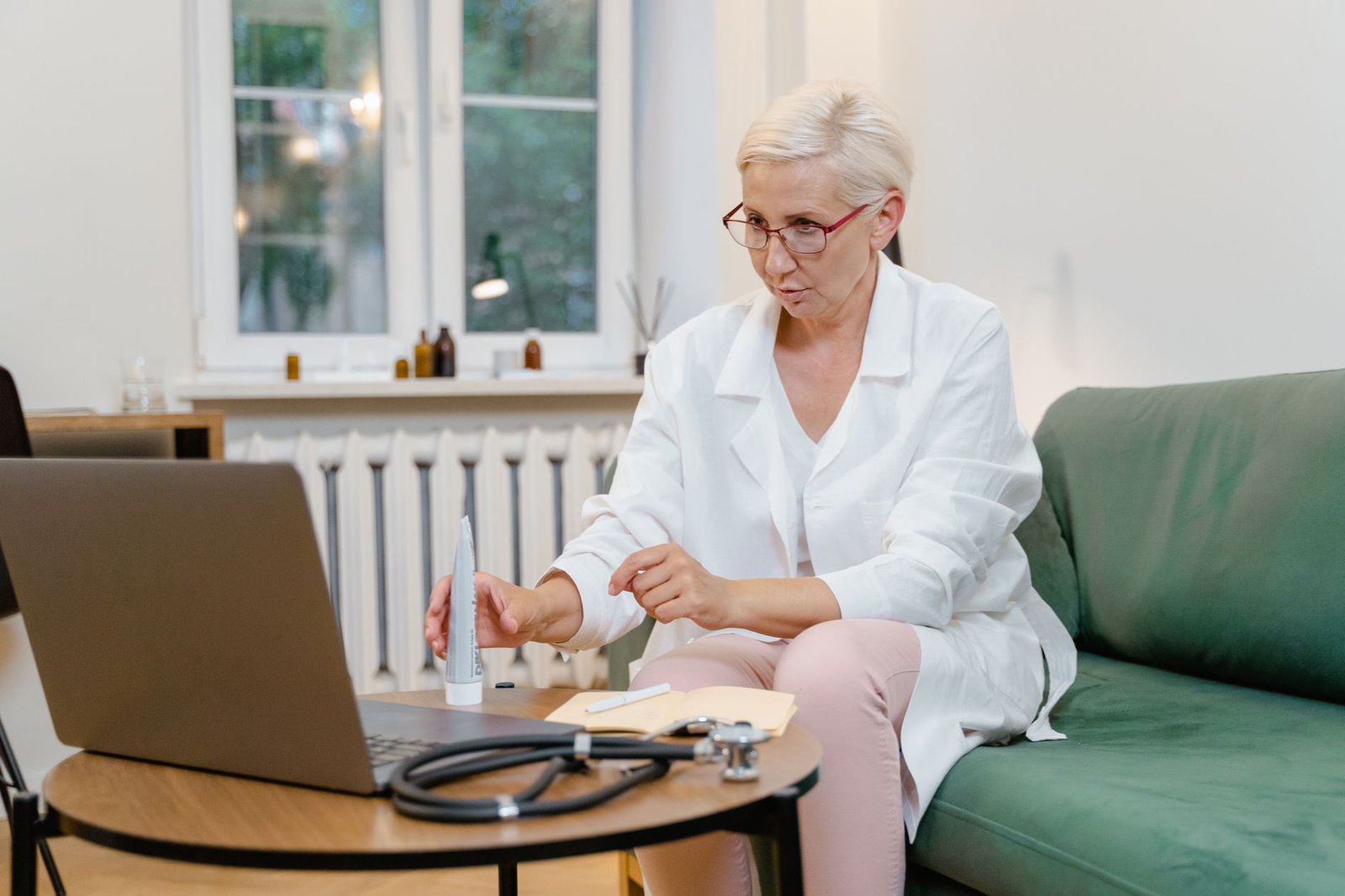 Veteran reviewing mesothelioma diagnosis records for a VA claim during a telehealth visit